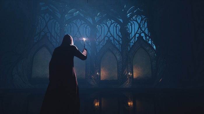 Hogwarts Legacy: Person with wand in dark hall