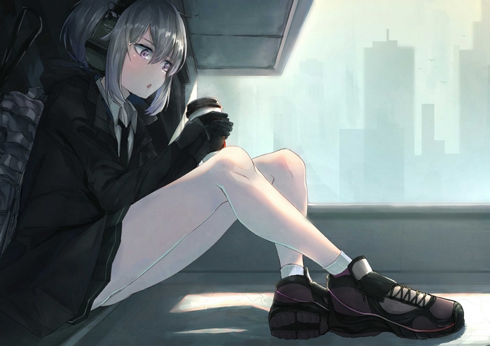 Girl with headphones holding a drink