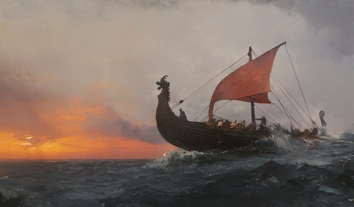 Viking longship sailing on the sea at sunset