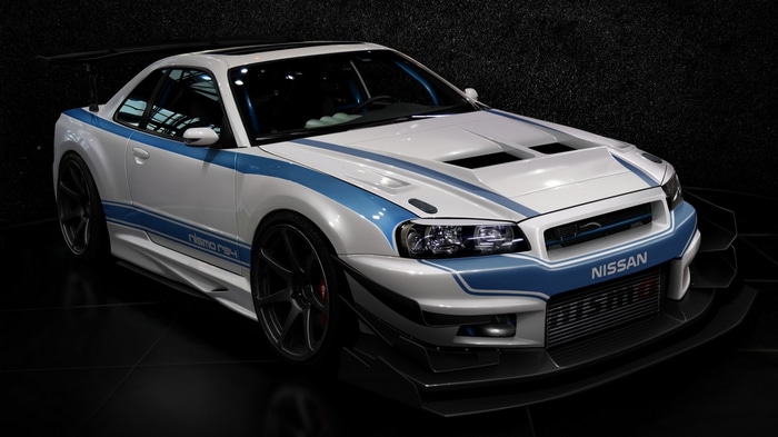 White Nissan Skyline R34 Nismo with Blue Stripes