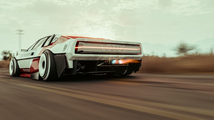Lotus car with engine exhaust on a road