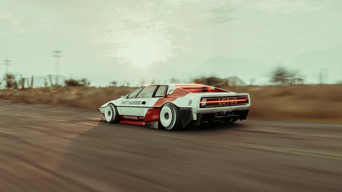 Lotus Esprit car driving on a dirt road