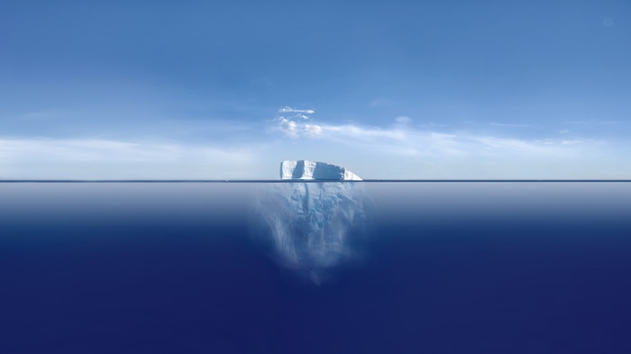 4K Iceberg in the Ocean Under Blue Sky