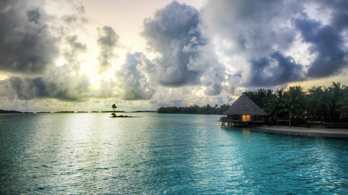 4K Overwater Bungalow with Palm Trees and Clouds