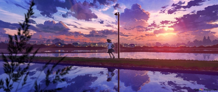 Girl in school uniform running by a flooded field at sunset