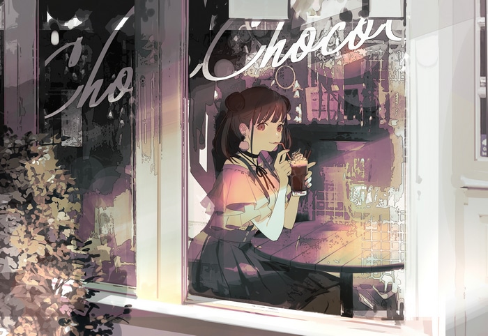 Girl drinking chocolate at a cafe window