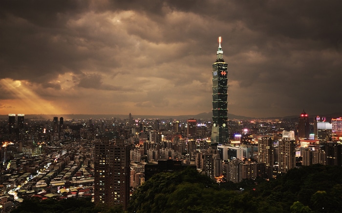 Taipei 101 skyscraper at sunset with city lights