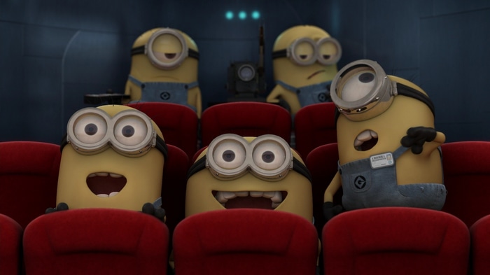 Minions watching a movie in a theater