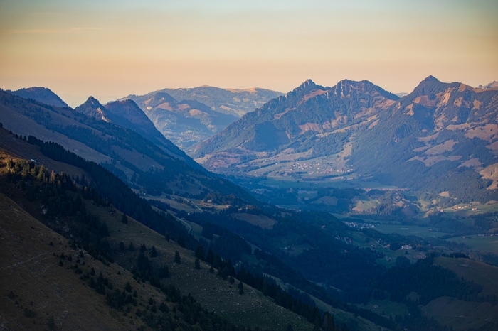 Mountain valley with rolling hills and trees