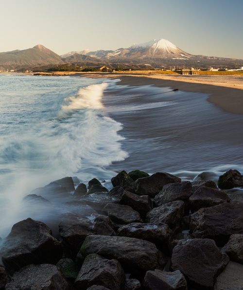 Mount Fuji and waves on a Japanese coast