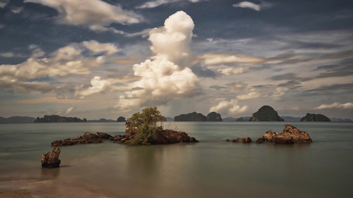 4K Trey Ratcliff clouds over islands and water