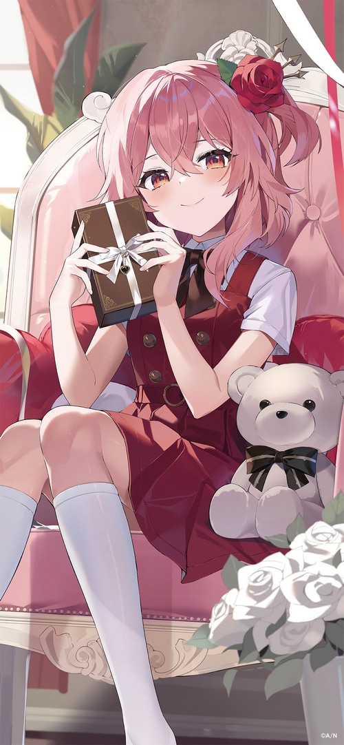 Rosemi Lovelock with a gift and teddy bear
