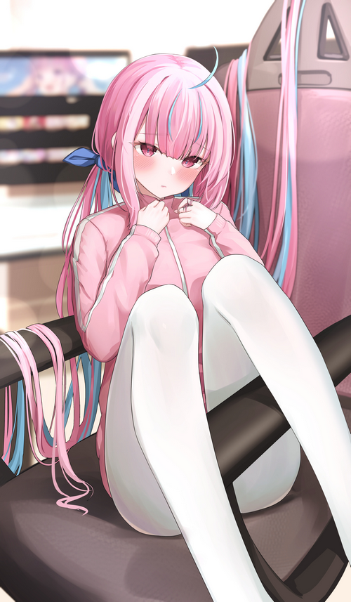 Minato Aqua sitting on a chair