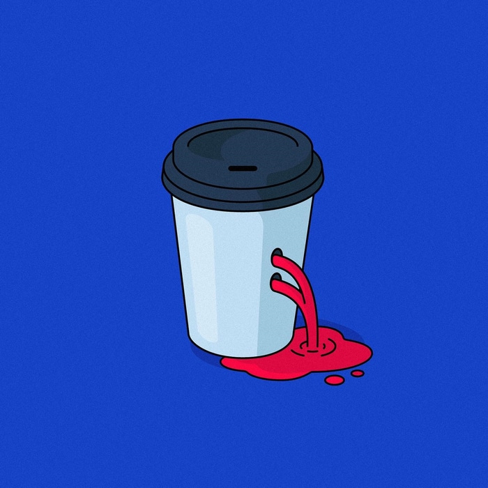 Coffee cup with bullet holes and red liquid spilling