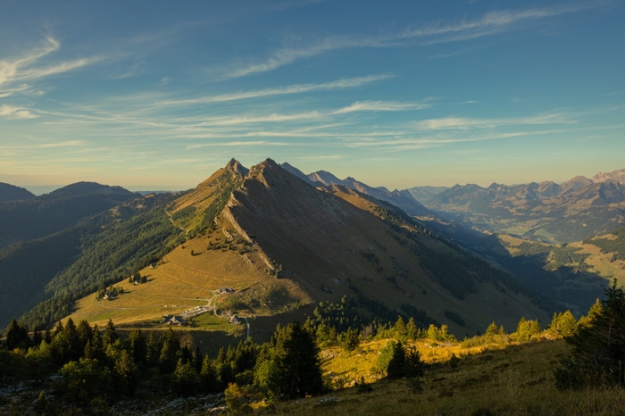 Swiss Alps mountain ridge with valley and forest