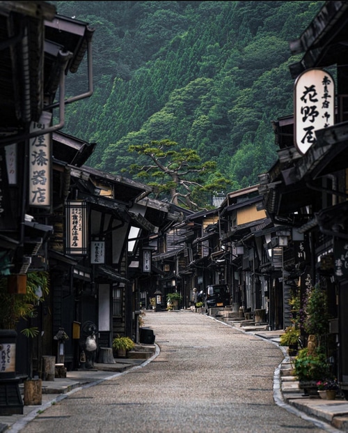 Narai-juku street with traditional Japanese architecture and forest