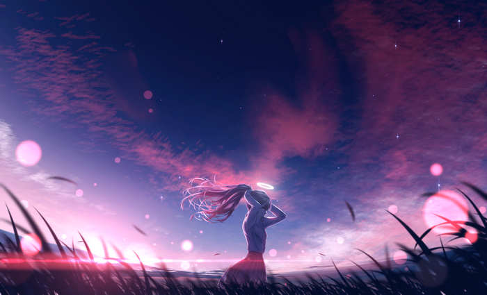 Girl with halo in a field at sunset