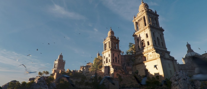 4K building with birds flying in the sky