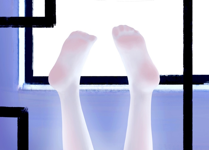 Feet in white pantyhose