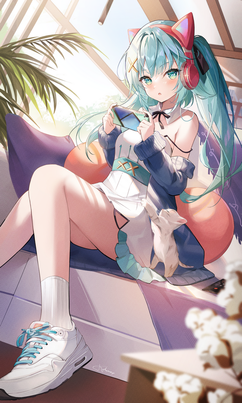 Anime girl with cat ears and headphones playing a game