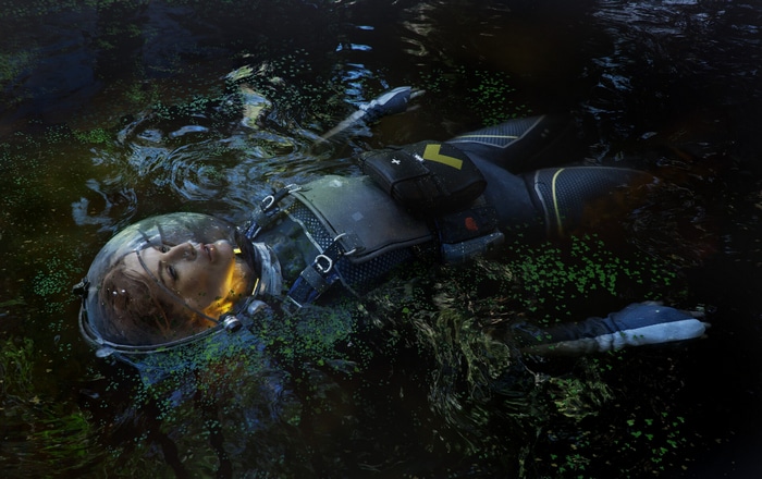 Woman in a spacesuit floating in dark water