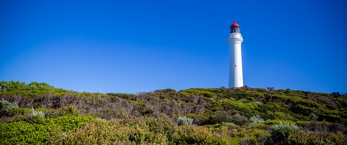 White lighthouse on a hill in Melbourne, Australia