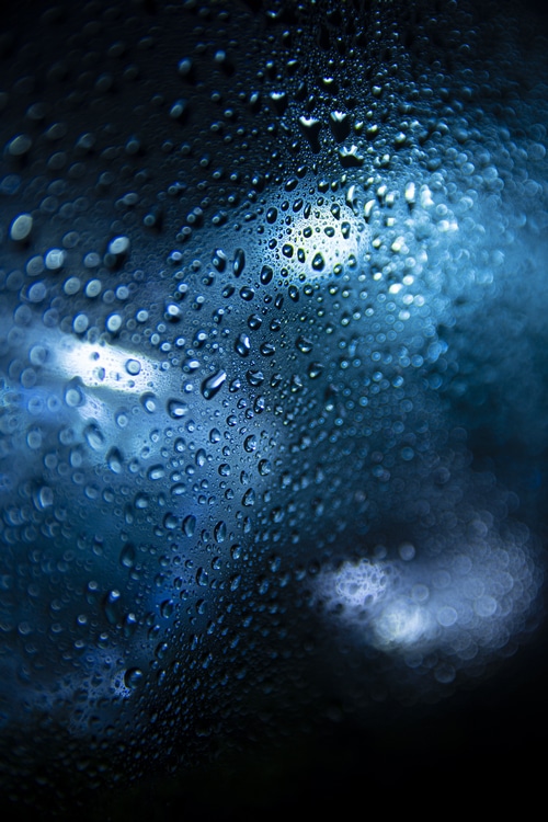 4K texture of water drops on glass