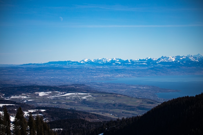 Snow-capped mountains over a lake and valley