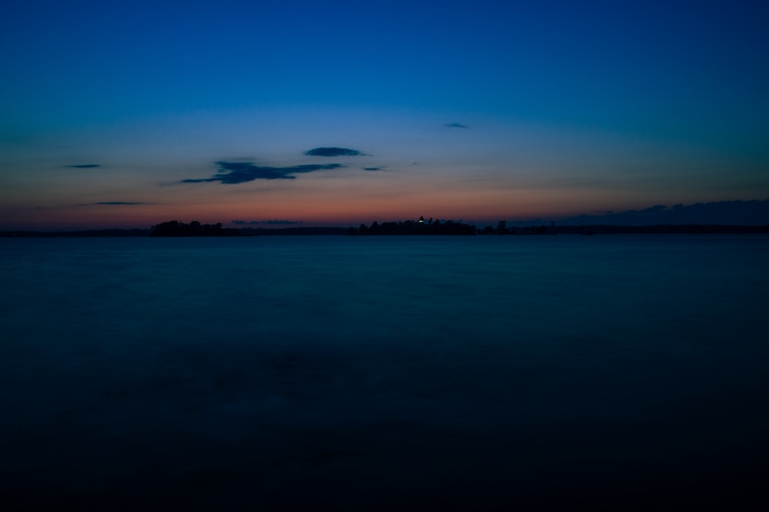 Dark minimalist lake at dusk