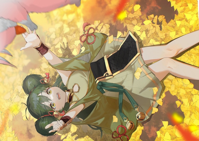 Girl with hair buns lying on leaves