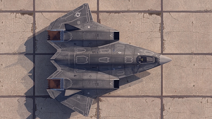 Top-down view of a stealth fighter jet on tarmac