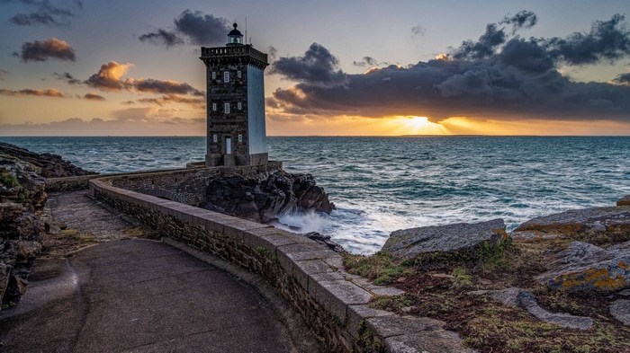Lighthouse on the coast at sunset