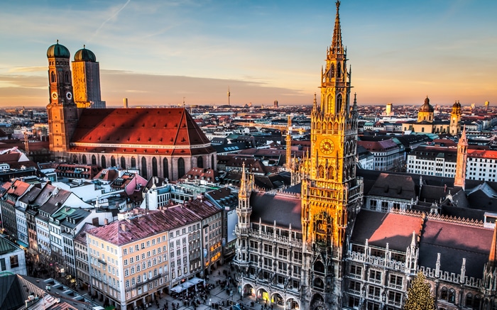 Munich cityscape with Frauenkirche and New Town Hall at sunset