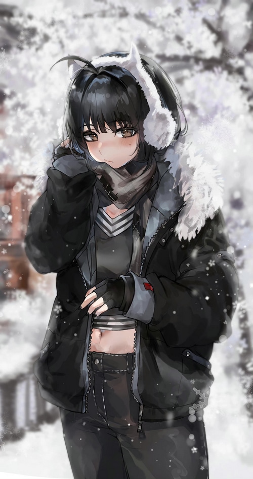 Girl in winter clothes with ear muffs in snow