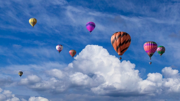 Hot air balloons in a cloudy sky