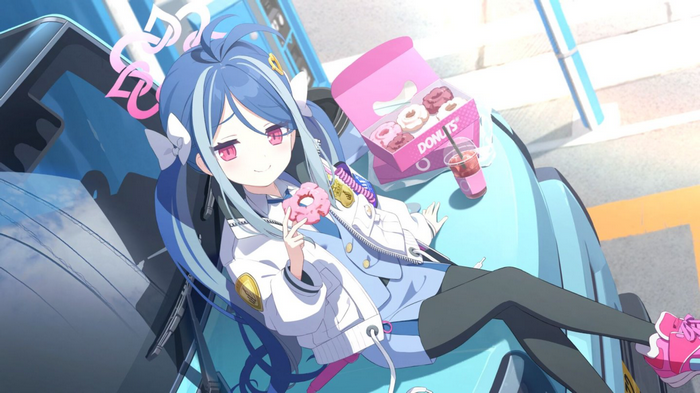 Girl with blue hair eating a donut
