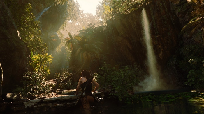 Lara Croft in a jungle with a waterfall