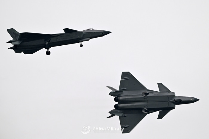 Two Chengdu J-20 fighter jets in flight