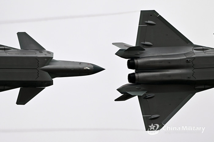 Two Chengdu J-20 fighter jets in flight