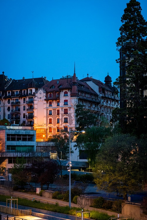 Buildings and trees at twilight in a city