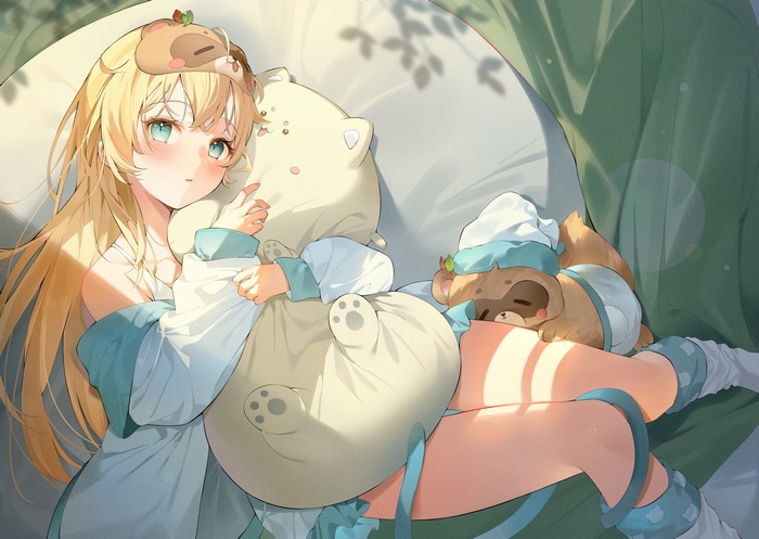 Girl with blonde hair and blue eyes holding a pillow