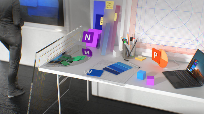 Microsoft Office logos on a desk with a laptop