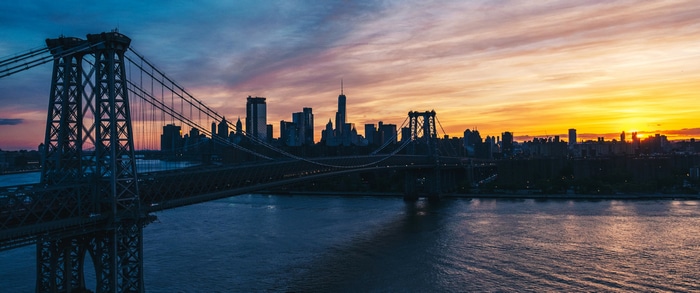 4K sunset over Manhattan Bridge and New York City skyline