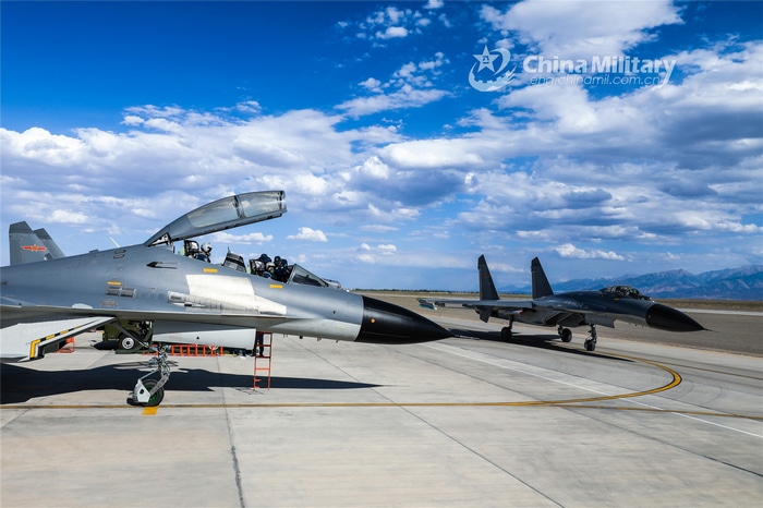 Chinese J-16 fighter jets on tarmac under cloudy sky