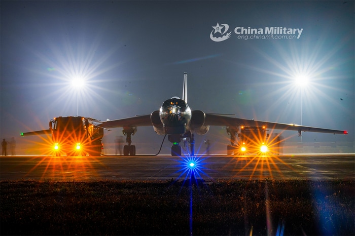 H-6 Bomber on the tarmac with bright lights