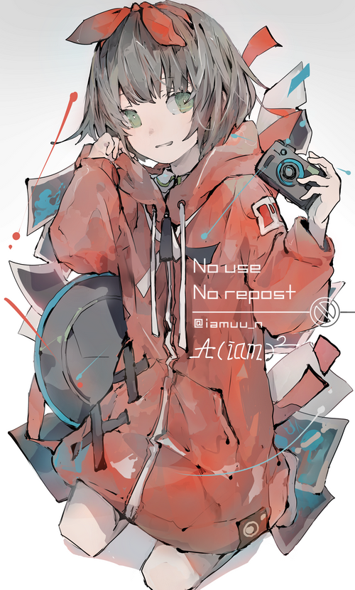 Aciam holding a camera with a red hoodie
