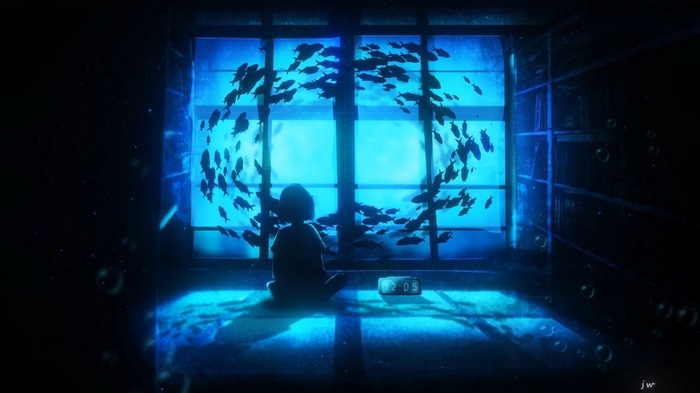 A person sits in a room with a school of fish outside the window.
