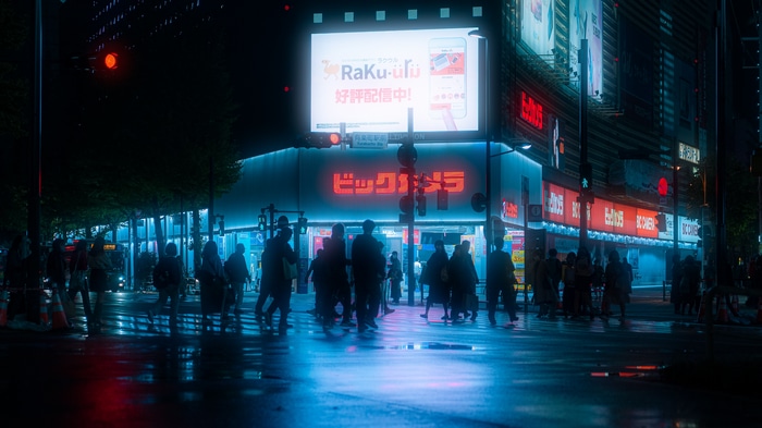 Big Camera at Night with People Crossing