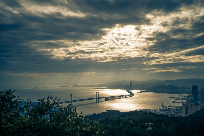4K Dalian China bridge over water with sun rays