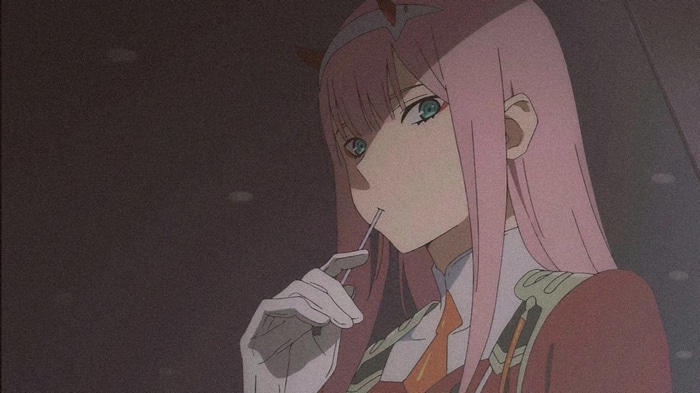 Zero Two from Darling in the FranXX eating a lollipop